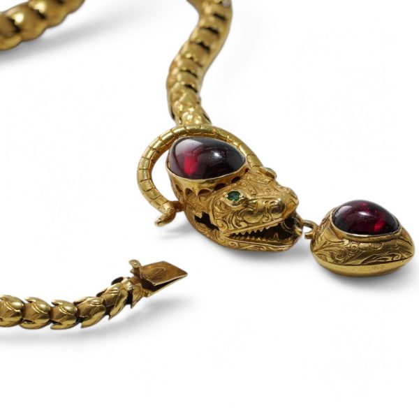 Victorian snake necklace with garnets and emeralds in gold.