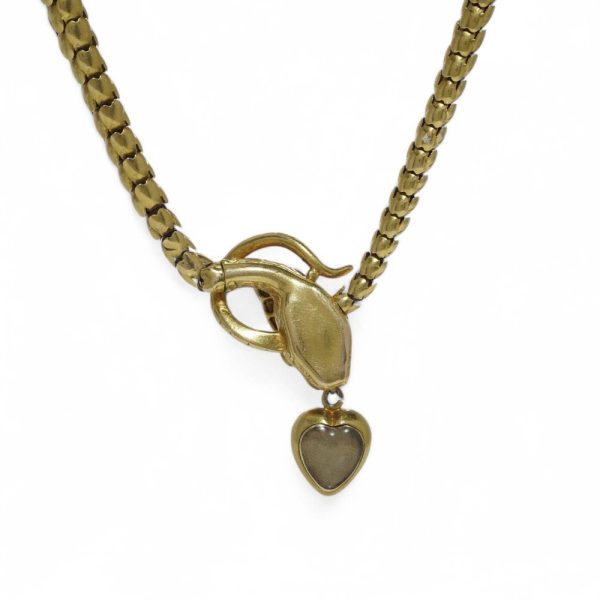 Victorian snake necklace with garnets and emeralds in gold.