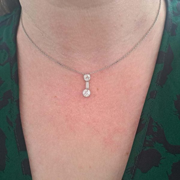 Antique Art Deco 1.35ct Old Cut Diamond Pendant Necklace in Platinum, 0.50ct old mine-cut, 0.15ct baguette-cut and 0.70ct old European transitional diamond