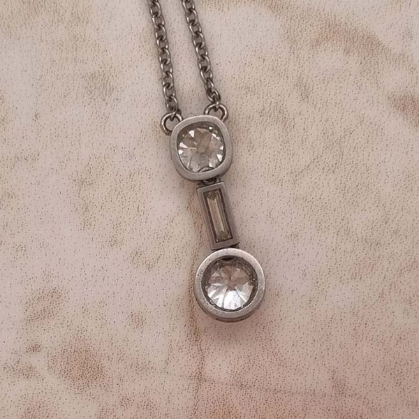 Antique Art Deco 1.35ct Old Cut Diamond Pendant Necklace in Platinum, 0.50ct old mine-cut, 0.15ct baguette-cut and 0.70ct old European transitional diamond