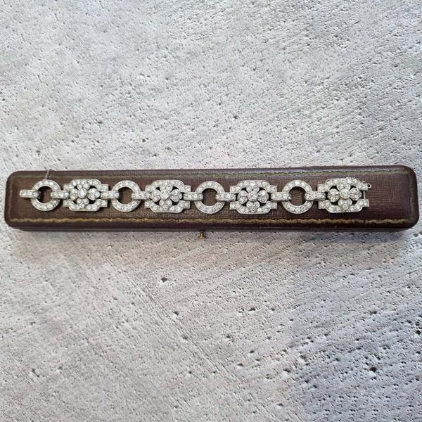 Art Deco French Diamond Bracelet in Platinum, floral motifs within geometric design, set with 20.80 carats of old brilliant-cut diamonds. Circa 1925
