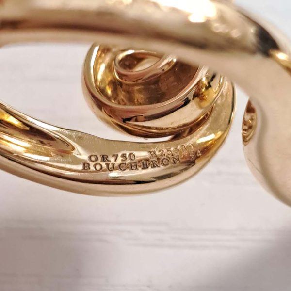 Boucheron Gold Double Finger Snake Ring, 18ct yellow gold snake worn over two fingers. Signed and numbered B25539