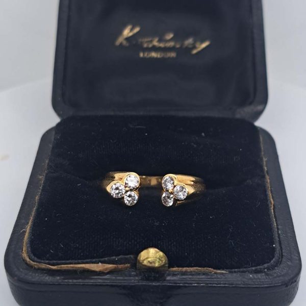 Vintage Kutchinsky Diamond Ring, tapered fluted 18ct yellow gold band to two sets of three sparkling diamonds to the front. Signed Kutchinsky, Circa 1975. Comes in a vintage Kutchinsky box