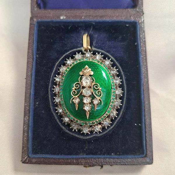 Victorian Antique Green Enamel and Diamond Locket Pendant, green enamel with rose-cut diamond surround and central design set in silver to 18ct yellow gold with floral detailed reverse panel which opens to reveal locket compartment. Comes in original antique fitted box