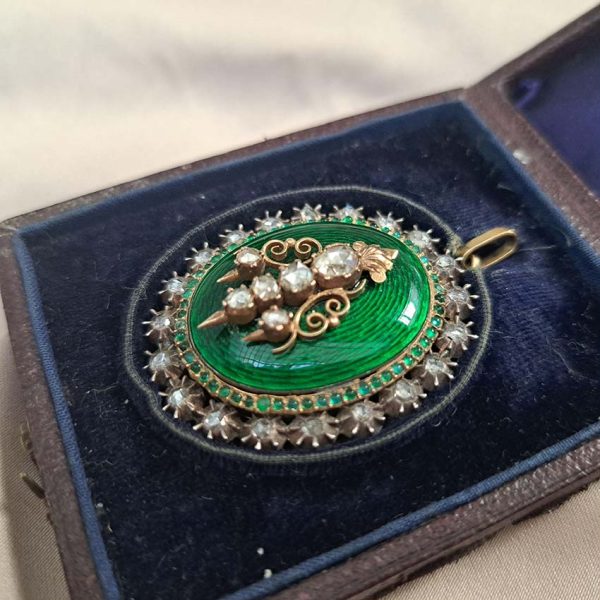 Victorian Antique Green Enamel and Diamond Locket Pendant, green enamel with rose-cut diamond surround and central design set in silver to 18ct yellow gold with floral detailed reverse panel which opens to reveal locket compartment. Comes in original antique fitted box