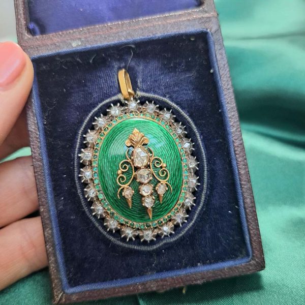 Victorian Antique Green Enamel and Diamond Locket Pendant, green enamel with rose-cut diamond surround and central design set in silver to 18ct yellow gold with floral detailed reverse panel which opens to reveal locket compartment. Comes in original antique fitted box