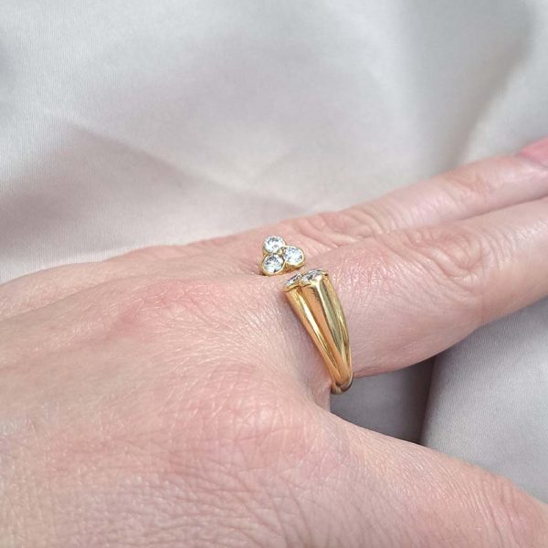 Vintage Kutchinsky Diamond Ring, tapered fluted 18ct yellow gold band to two sets of three sparkling diamonds to the front. Signed Kutchinsky, Circa 1975. Comes in a vintage Kutchinsky box