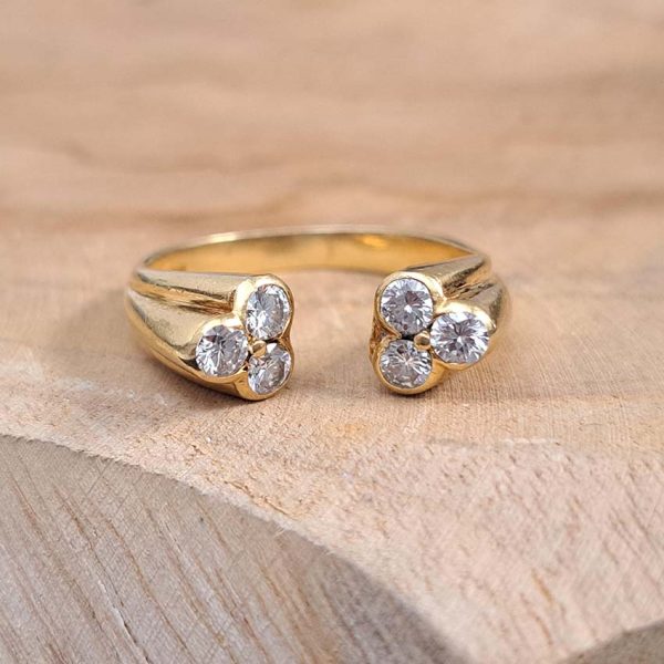 Vintage Kutchinsky Diamond Ring, tapered fluted 18ct yellow gold band to two sets of three sparkling diamonds to the front. Signed Kutchinsky, Circa 1975. Comes in a vintage Kutchinsky box