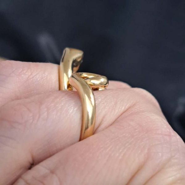 Boucheron Gold Double Finger Snake Ring, 18ct yellow gold snake worn over two fingers. Signed and numbered B25539
