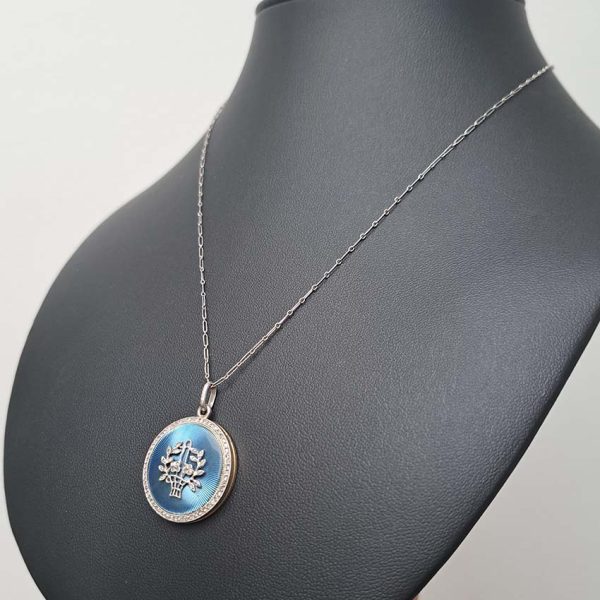 Antique Blue Enamel and Diamond Locket Pendant, cornflower blue enamel with central diamond floral pattern within diamond border. Hidden locket compartment to reverse