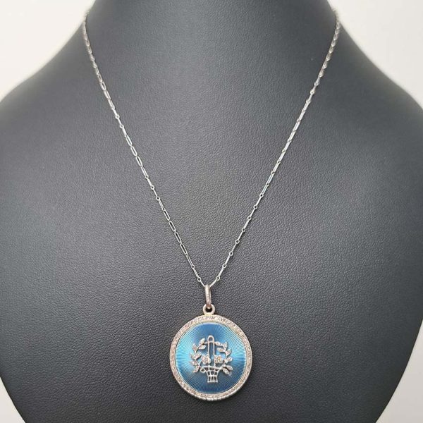 Antique Blue Enamel and Diamond Locket Pendant, cornflower blue enamel with central diamond floral pattern within diamond border. Hidden locket compartment to reverse