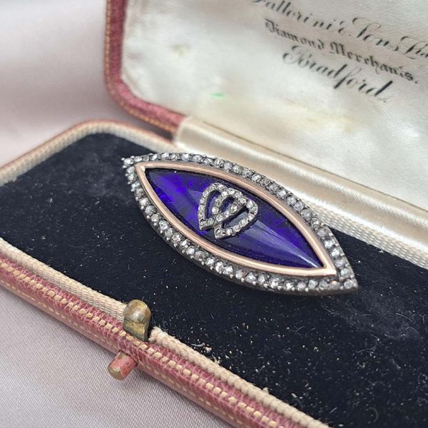 Victorian Antique Blue Enamel and Diamond Navette Brooch, navette-shaped brooch decorated with blue enamel with two diamond entwinned hearts within diamond border