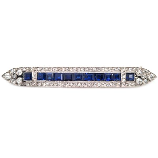 Art Deco 5.5ct Sapphire and Diamond Bar Brooch in Platinum, line of baguette rectangular square shaped step-cut sapphires within 3.50ct old European transitional cut diamonds