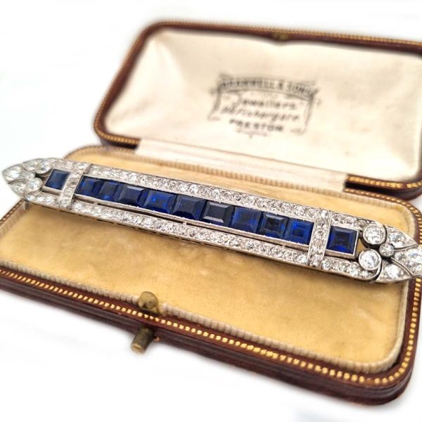 Art Deco 5.5ct Sapphire and Diamond Bar Brooch in Platinum, line of baguette rectangular square shaped step-cut sapphires within 3.50ct old European transitional cut diamonds