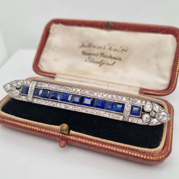 Art Deco 5.5ct Sapphire and Diamond Bar Brooch in Platinum, line of baguette rectangular square shaped step-cut sapphires within 3.50ct old European transitional cut diamonds