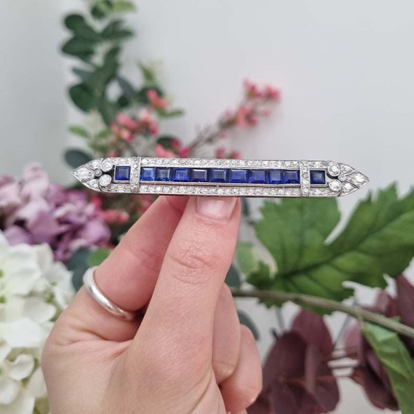 Art Deco 5.5ct Sapphire and Diamond Bar Brooch in Platinum, line of baguette rectangular square shaped step-cut sapphires within 3.50ct old European transitional cut diamonds