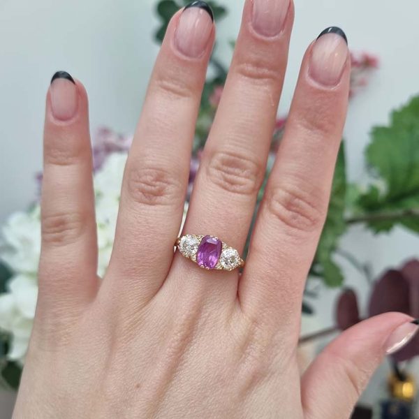 Antique 2ct Natural Pink Sapphire and Diamond Trilogy Three Stone Engagement Ring, 2.03ct deep purplish pink sapphire flanked by 1ct old-cut diamonds in 18ct yellow gold. Circa 1880