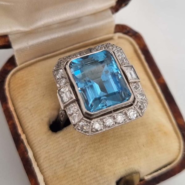 Vintage Santa Maria Aquamarine and Diamond Cluster Dress Ring, intense blue emerald-cut aquamarine millegrain set within 1ct old-cut diamond border in platinum