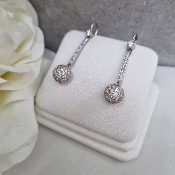 Vintage 1ct Diamond Ball Sphere Cluster Drop Earrings, diamond encrusted spheres suspended from diamond drops in platinum with shepherd hook fittings. Circa 1930