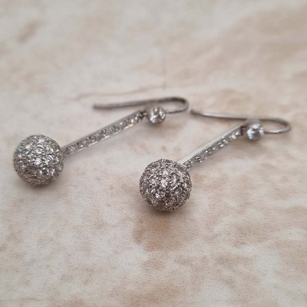 Vintage 1ct Diamond Ball Sphere Cluster Drop Earrings, diamond encrusted spheres suspended from diamond drops in platinum with shepherd hook fittings. Circa 1930