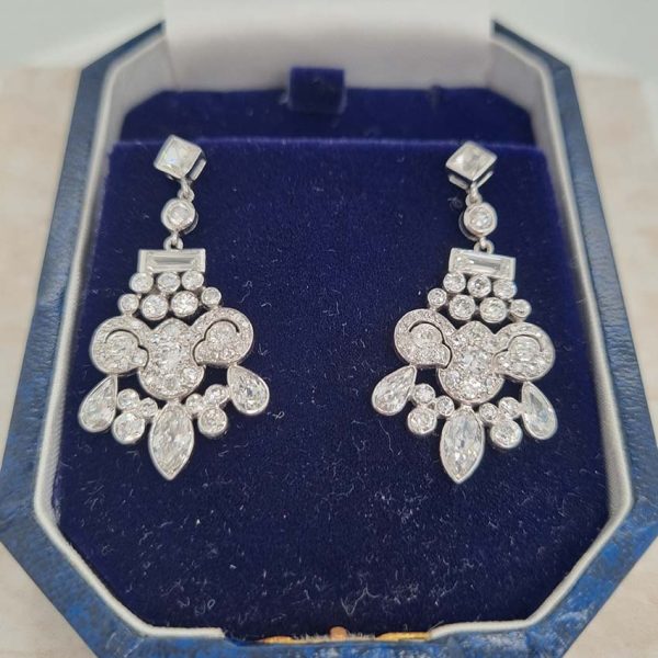 Belle Epoque Antique 2.30ct Diamond Chandelier Drop Earrings, French cut diamond tops suspend graduating fans of baguette, old cut round, marquise and pear cut diamonds, with central stylised leaf giardiniera design in platinum