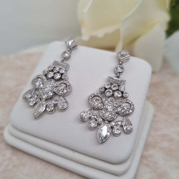 Belle Epoque Antique 2.30ct Diamond Chandelier Drop Earrings, French cut diamond tops suspend graduating fans of baguette, old cut round, marquise and pear cut diamonds, with central stylised leaf giardiniera design in platinum