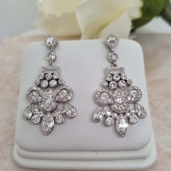 Belle Epoque Antique 2.30ct Diamond Chandelier Drop Earrings, French cut diamond tops suspend graduating fans of baguette, old cut round, marquise and pear cut diamonds, with central stylised leaf giardiniera design in platinum