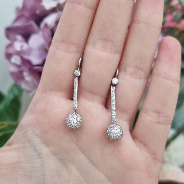 Vintage 1ct Diamond Ball Sphere Cluster Drop Earrings, diamond encrusted spheres suspended from diamond drops in platinum with shepherd hook fittings. Circa 1930