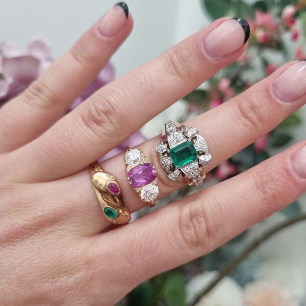 Vintage Colombian Emerald and Diamond Cluster Dress Ring, 0.81ct emerald-cut Colombian emerald within decorative fan design diamond surround to arched shoulders with central diamonds in 18ct yellow gold. Circa 1950s