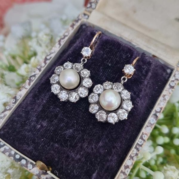 Antique Natural Pearl and 6ct Old Cut Diamond Cluster Drop Earrings, natural button saltwater pearls surrounded by 6cts old mine-cut diamonds in silver to 18ct yellow gold. Late 19th century Circa 1880