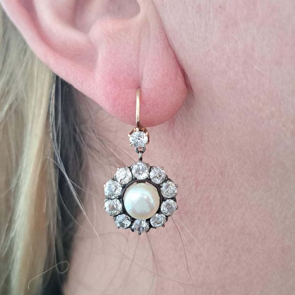 Antique Natural Pearl and 6ct Old Cut Diamond Cluster Drop Earrings, natural button saltwater pearls surrounded by 6cts old mine-cut diamonds in silver to 18ct yellow gold. Late 19th century Circa 1880