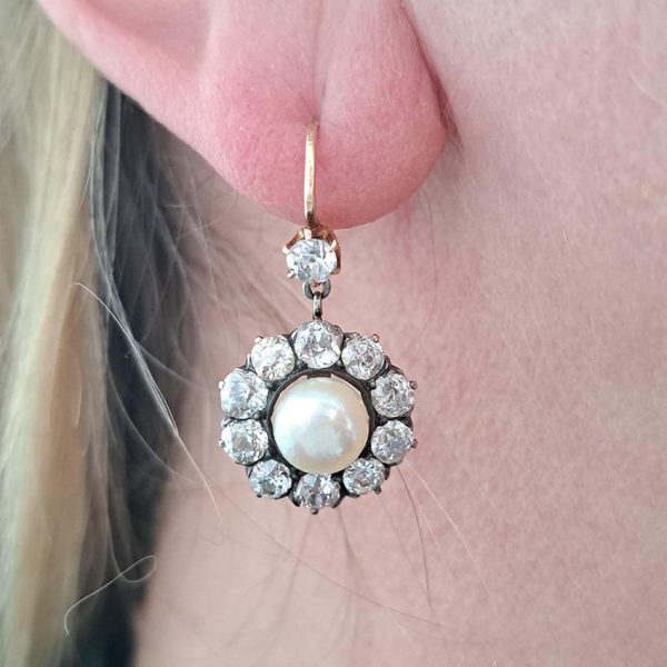 Antique Natural Pearl and 6ct Old Cut Diamond Cluster Drop Earrings, natural button saltwater pearls surrounded by 6cts old mine-cut diamonds in silver to 18ct yellow gold. Late 19th century Circa 1880