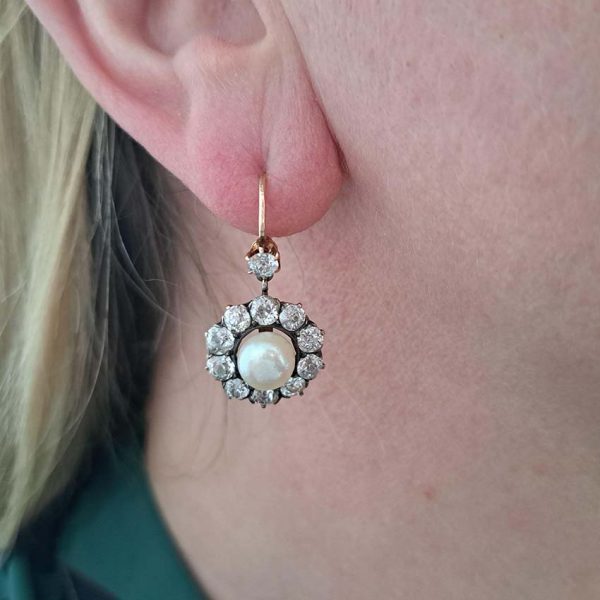 Antique Natural Pearl and 6ct Old Cut Diamond Cluster Drop Earrings, natural button saltwater pearls surrounded by 6cts old mine-cut diamonds in silver to 18ct yellow gold. Late 19th century Circa 1880