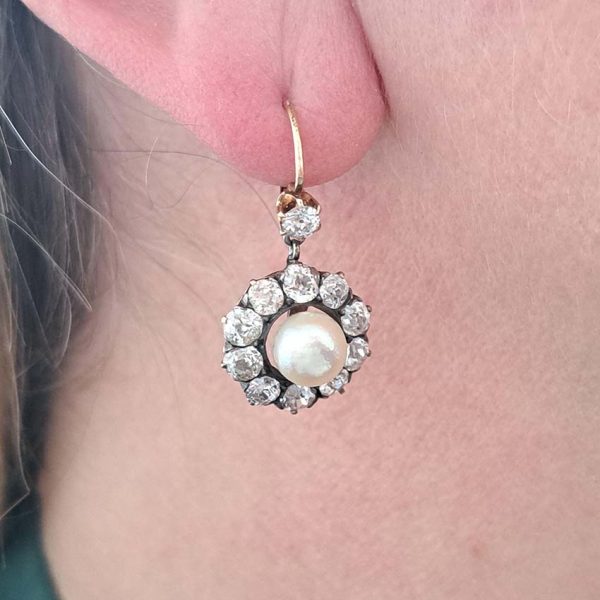 Antique Natural Pearl and 6ct Old Cut Diamond Cluster Drop Earrings, natural button saltwater pearls surrounded by 6cts old mine-cut diamonds in silver to 18ct yellow gold. Late 19th century Circa 1880