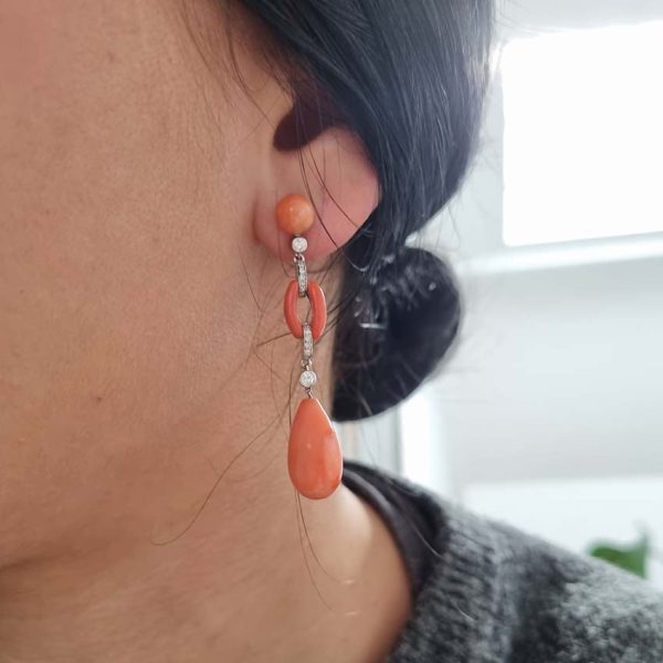 Art Deco Coral and Diamond Drop Earrings, round cabochon coral top leading to articulated diamond and coral links to pear shaped coral teardrop pendant drops in 18ct white gold. Circa 1930s