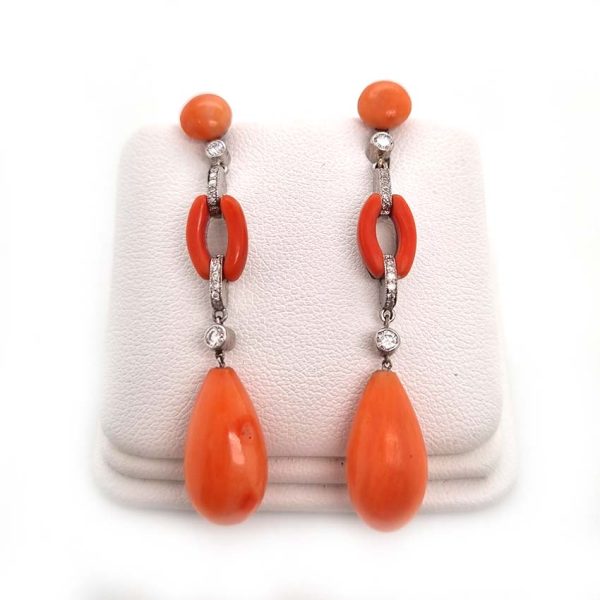 Art Deco Coral and Diamond Drop Earrings, round cabochon coral top leading to articulated diamond and coral links to pear shaped coral teardrop pendant drops in 18ct white gold. Circa 1930s