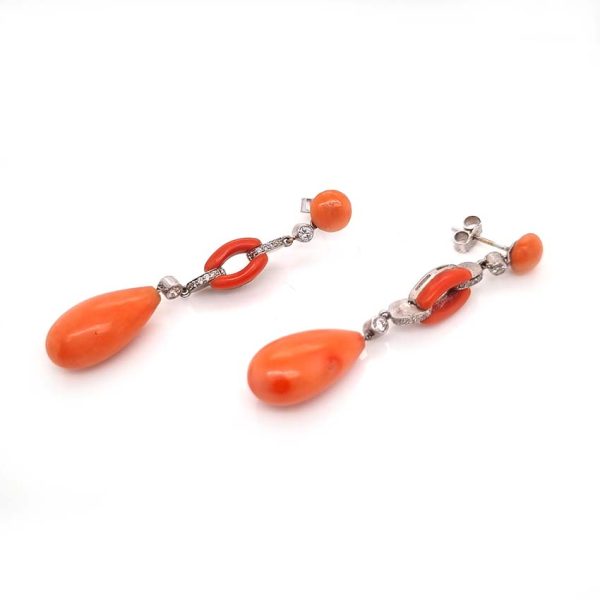 Art Deco Coral and Diamond Drop Earrings, round cabochon coral top leading to articulated diamond and coral links to pear shaped coral teardrop pendant drops in 18ct white gold. Circa 1930s