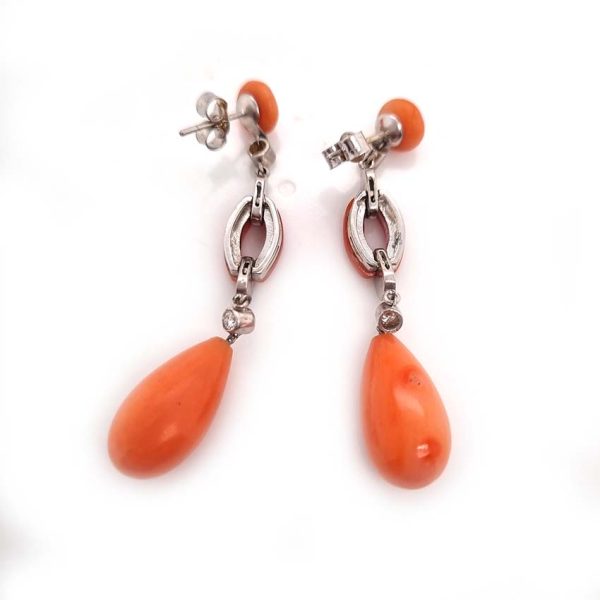 Art Deco Coral and Diamond Drop Earrings, round cabochon coral top leading to articulated diamond and coral links to pear shaped coral teardrop pendant drops in 18ct white gold. Circa 1930s