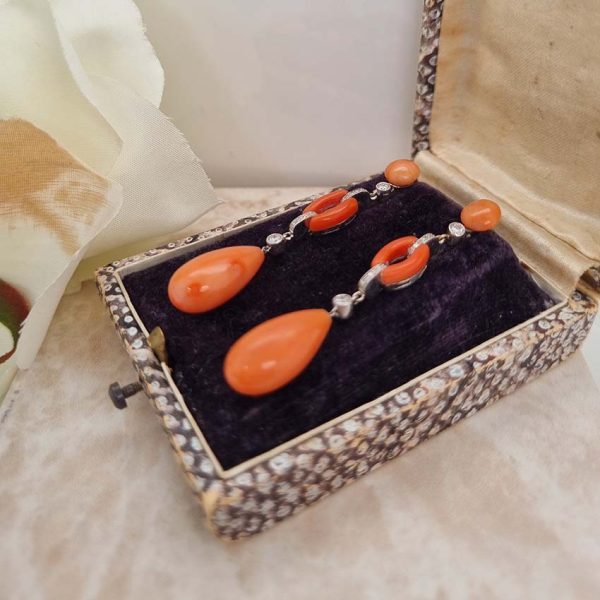 Art Deco Coral and Diamond Drop Earrings, round cabochon coral top leading to articulated diamond and coral links to pear shaped coral teardrop pendant drops in 18ct white gold. Circa 1930s