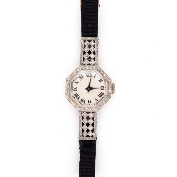 Art Deco Diamond Platinum Quartz Cocktail Watch, Circa 1920, octagonal platinum case features sparkling diamonds set around the bezel and on the top and bottom attachments