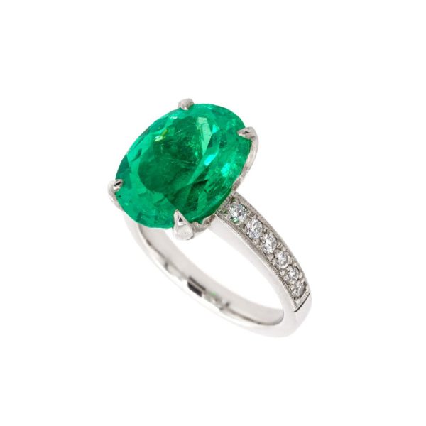 Emerald and diamond ring set in platinum.