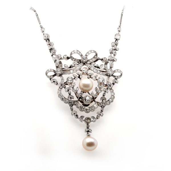 Diamond and pearl pendant on platinum chain.