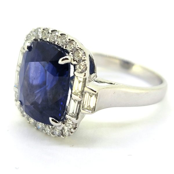 Fine 6.97ct Cushion Cut Sapphire and Diamond Cluster Ring, accented with baguette-cut diamonds to the shoulders in 18ct white gold