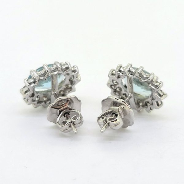 2.50ct Aquamarine and Diamond Oval Cluster Stud Earrings, Oval aquamarines surrounded by round brilliant-cut diamonds claw set in 18ct white gold