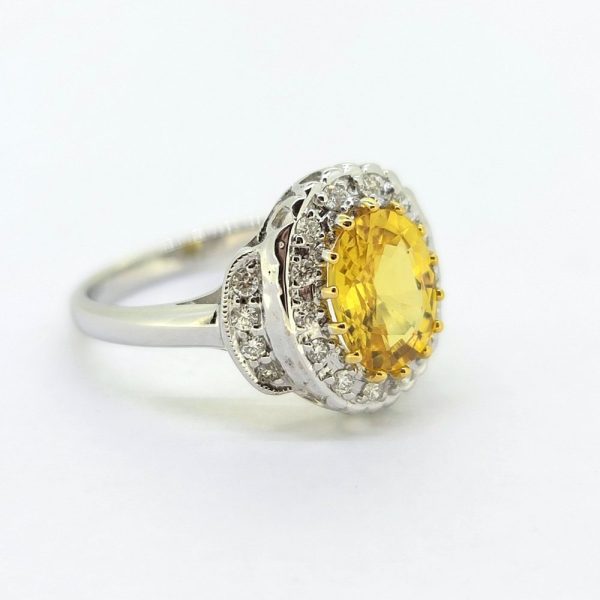 Decorative 2.1ct Oval Yellow Sapphire and Diamond Cluster Dress Ring with diamond stepped shoulders in 18ct white gold