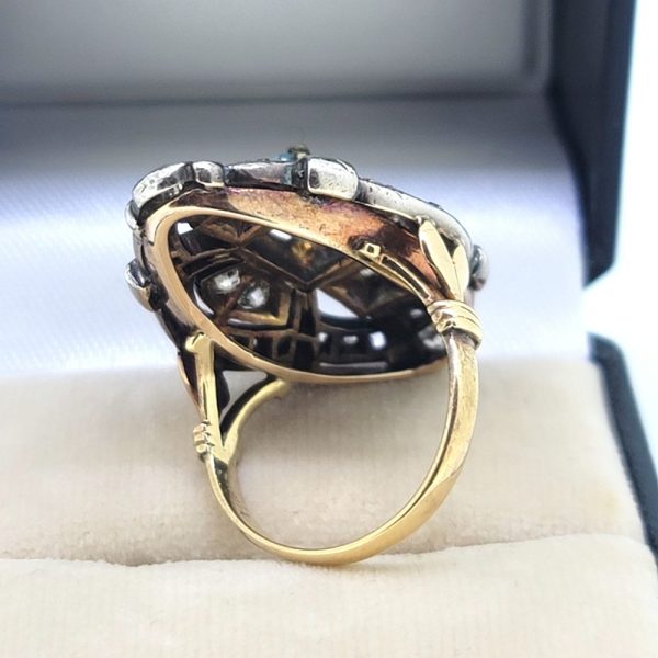 Aquamarine and Diamond Navette Cluster Ring in Silver on Gold, emerald-cut aquamarine nestled within diamond-set openwork navette-shaped surround