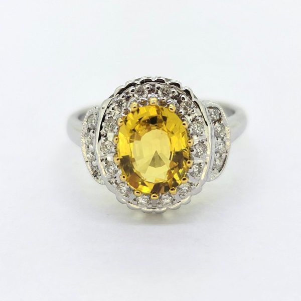 Decorative 2.1ct Oval Yellow Sapphire and Diamond Cluster Dress Ring with diamond stepped shoulders in 18ct white gold