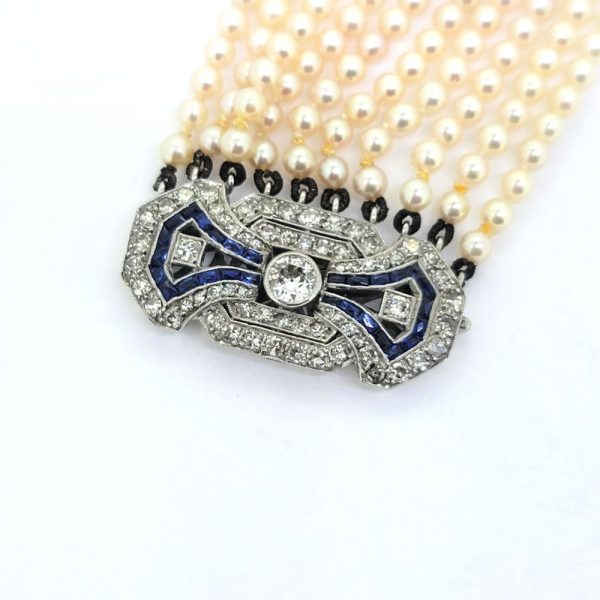Art Deco Multi Strand Pearl Bracelet with Diamond and Sapphire Clasp, ten strands of well-matched cultured Akoya pearls with sapphire and diamond clasp