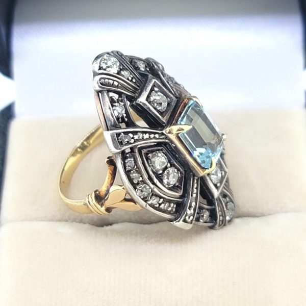 Aquamarine and Diamond Navette Cluster Ring in Silver on Gold, emerald-cut aquamarine nestled within diamond-set openwork navette-shaped surround
