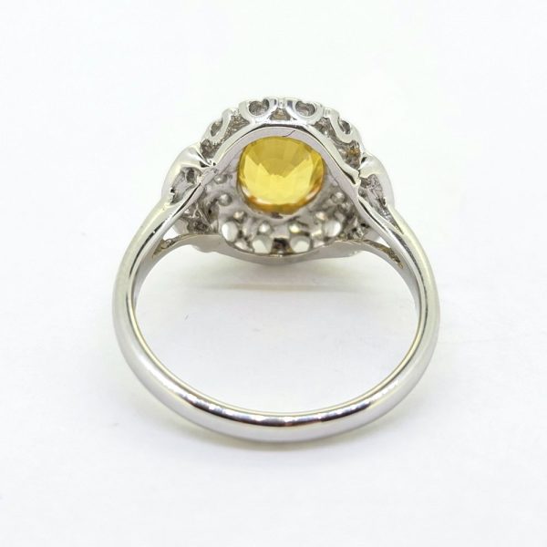 Decorative 2.1ct Oval Yellow Sapphire and Diamond Cluster Dress Ring with diamond stepped shoulders in 18ct white gold